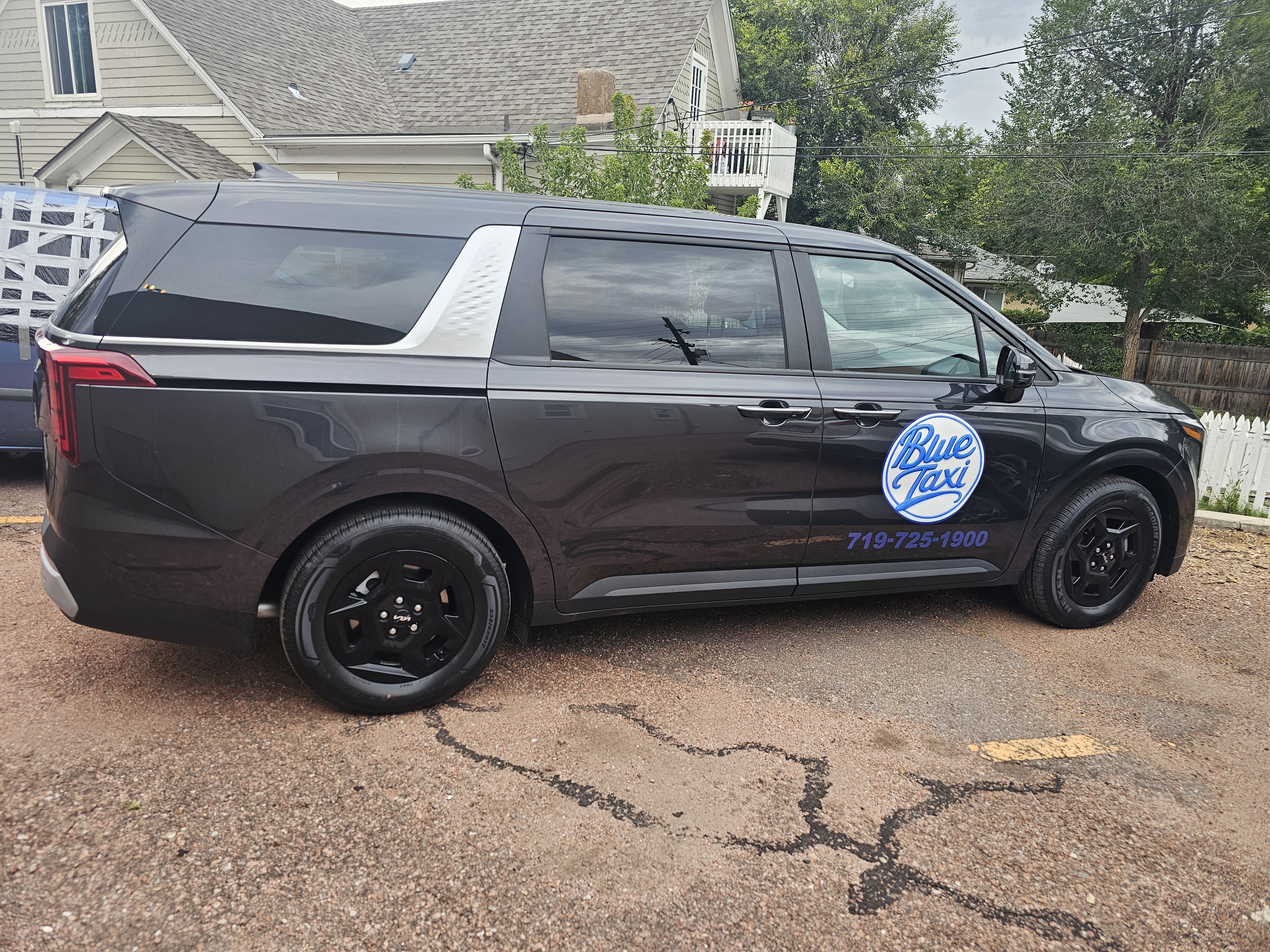 Blue Taxi Kia Carnival