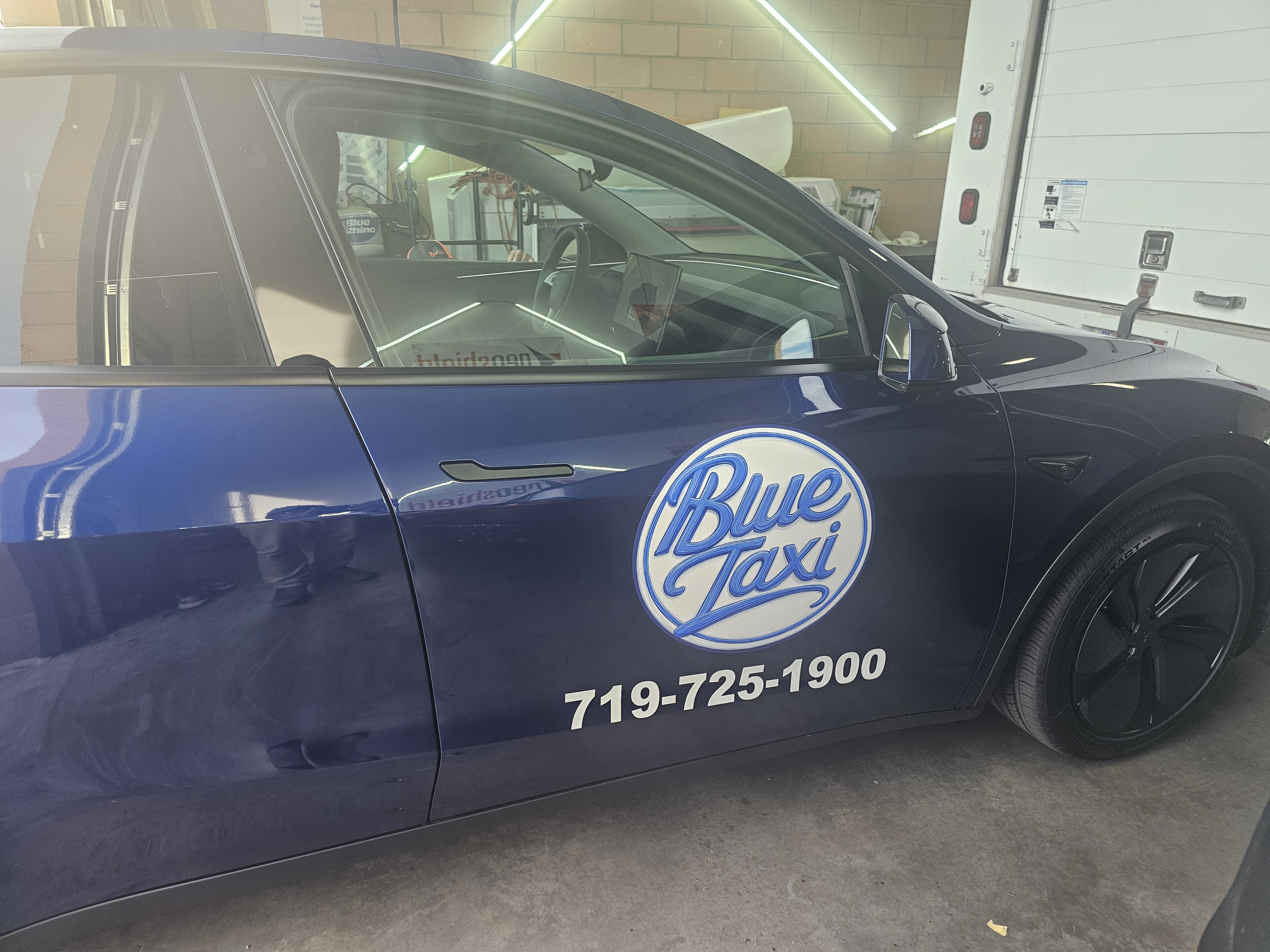 Blue Taxi Tesla